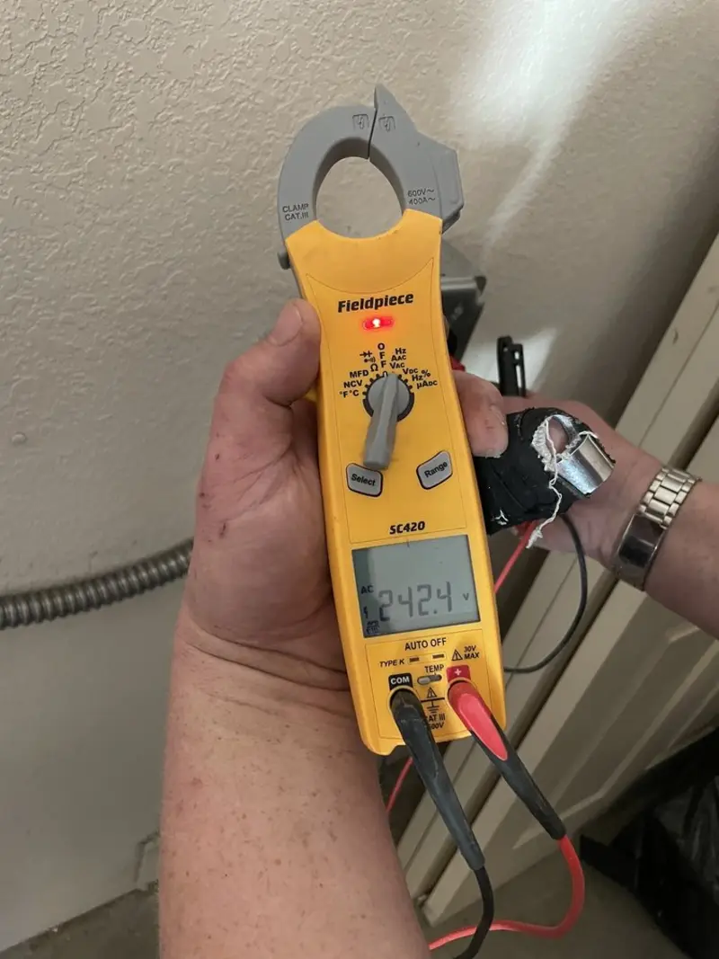 Voltage testing with clamp meter during Electrical Installation Services in Fair Haven